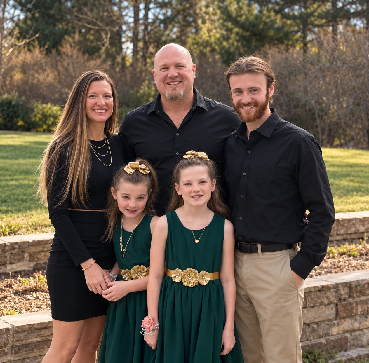 Eric Quinn with his family outdoors in warm golden light